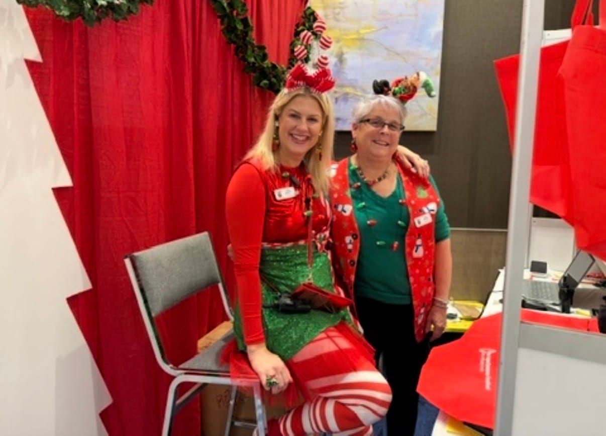 Festival staff in holiday outfits at the New England Christmas Festival